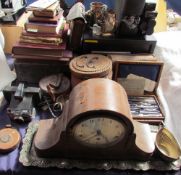 A walnut cased mantle clock together with books, polaroid camera, geometry set, epns etc