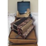 A Hohner Lilliput button accordion, cased together with a bassoon case