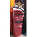 An red painted and brass fire extinguisher containing 2 imperial gallons