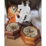 Two Staffordshire lions with glass eyes together with a Staffordshire figure group and four framed