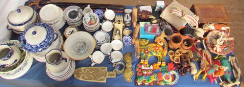 A large lot including Mexican carvings together with walking sticks, part tea and dinner services,