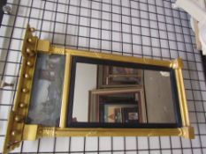 A Regency gilt gesso wall mirror of rectangular form,