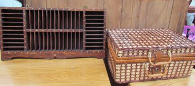 A brass inlaid wall cabinet together with a wicker picnic basket