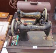 A Singer sewing machine cased,