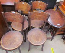 A set of four Fischel bentwood dining chairs with faux crocodile textured seats and back together