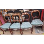 A set of six Victorian mahogany balloon back dining chairs with upholstered seats on shaped legs