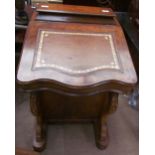 A Victorian walnut Davenport desk, with a stationery compartment, sloping fall,