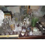 Assorted glass vases, glass bowls, drinking glasses,