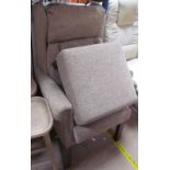 A modern upholstered wing back chair and matching foot stool