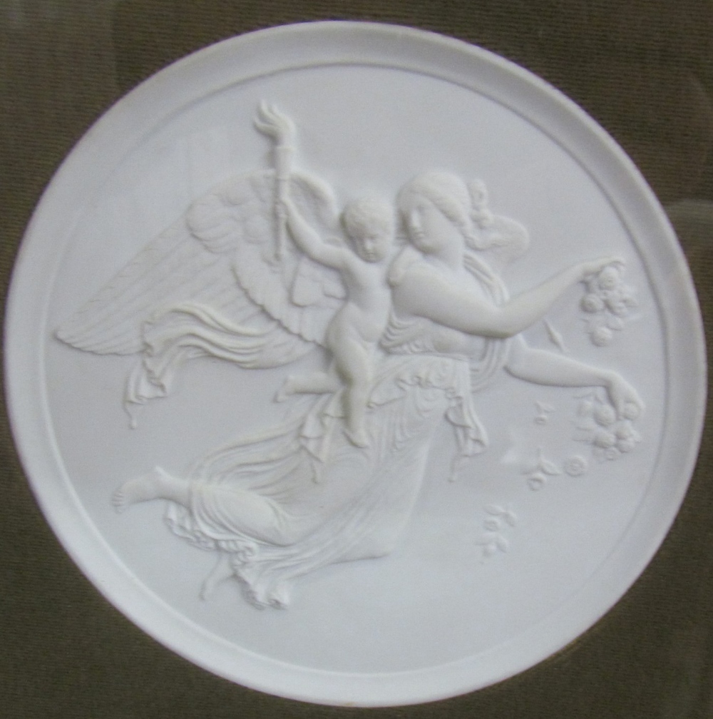 A pair of parian plaques depicting an angel,