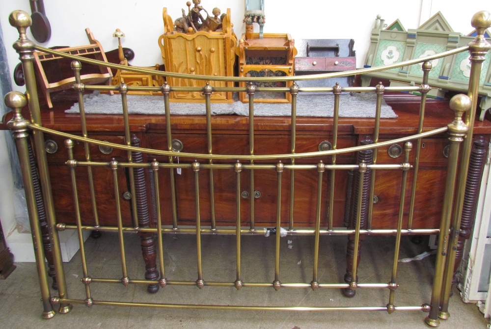 A modern brass king size bed,
