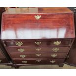 A George III mahogany bureau, the sloping fall enclosing a fitted interior,