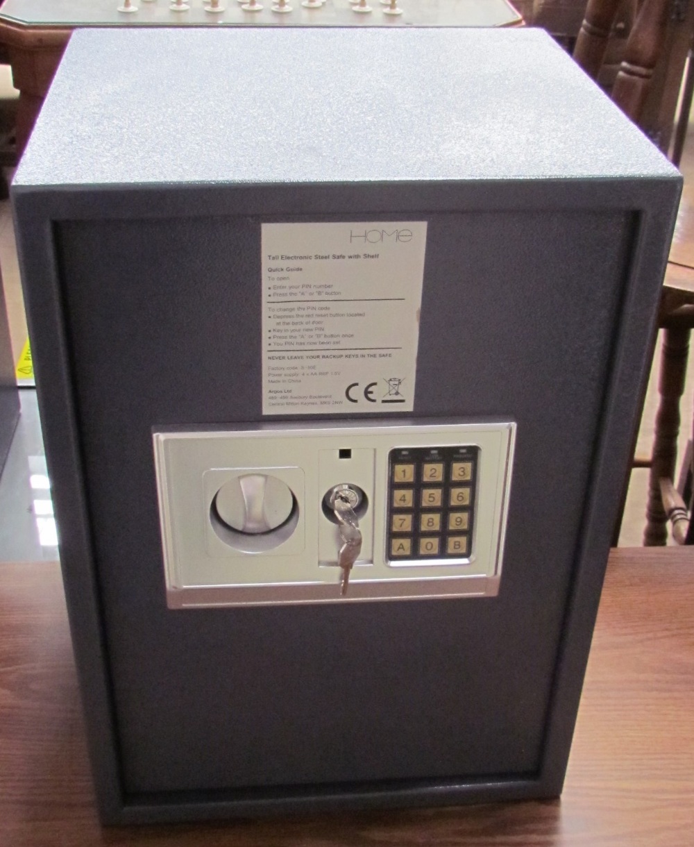 An Argos Home electronic safe with an key pad and override keys