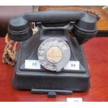 A bakelite telephone, with a pull out tray,