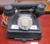 A bakelite telephone, with a pull out tray,