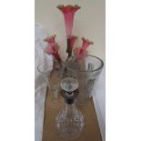 A silver topped decanter, together with a cranberry glass epergne,