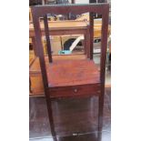 A George III mahogany washstand of square form, with a recessed top above an undertier,