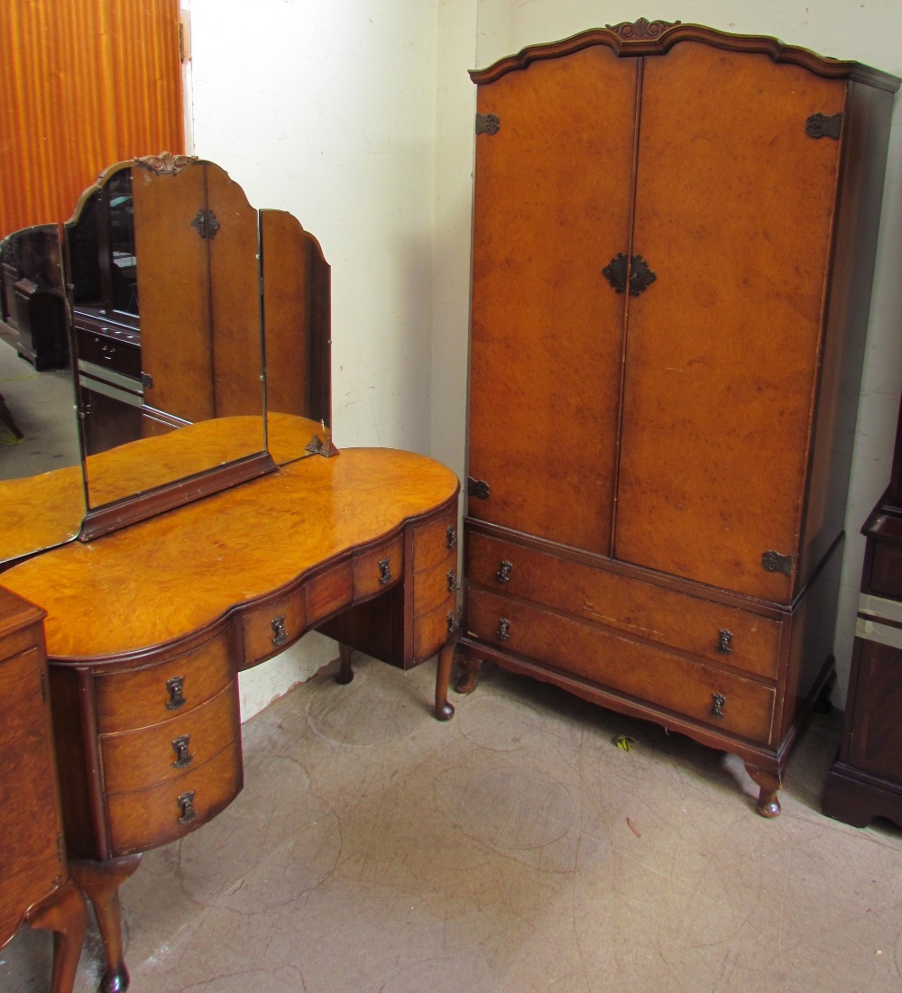 A 20th century burr walnut wardrobe and matching dressing table