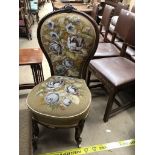 A Victorian Lady's chair with bead work upholstered seat and back on carved legs and ceramic