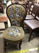 A Victorian Lady's chair with bead work upholstered seat and back on carved legs and ceramic