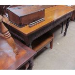 A 20th century oak refectory dining table of rectangular form on turned legs together with a teak