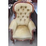 A Victorian mahogany framed spoon back library chair with button back upholstery,