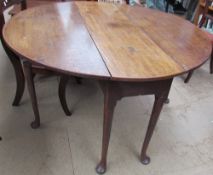 A mid 18th century oak dining table,