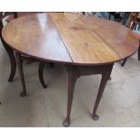 A mid 18th century oak dining table,