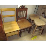 A modern oak metamorphic library chair together with a carved oak chair and a pair of stools