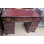 A reproduction mahogany pedestal desk,