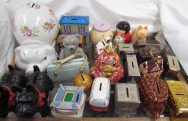 Twenty four assorted pottery and metal money boxes etc