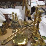 A pair of brass candlesticks, together with a chestnut basket, fire dogs,