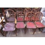 A set of four stick back dining chairs (includes a carver) together with a set of four wheel back