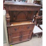 A 20th century oak side cabinet, with a rectangular top above a single door,