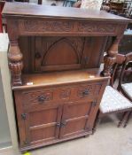 A 20th century oak side cabinet, with a rectangular top above a single door,