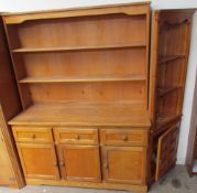 A 20th century ash dresser with a planked back above three short drawers and three cupboards on a