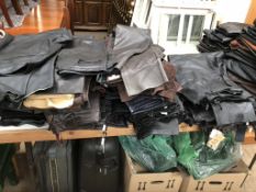 A large collection of leather clothes including jackets, skirts,