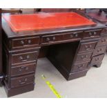 A reproduction mahogany pedestal desk,