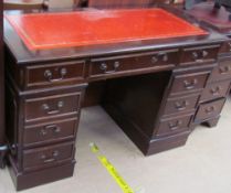 A reproduction mahogany pedestal desk,