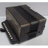 A Hohner button accordion,