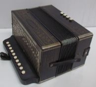 A Hohner button accordion,