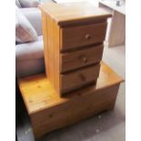 A pine bedside chest with three drawers together with a pine trunk