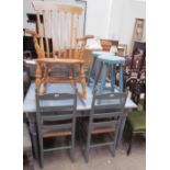 A painted pine kitchen table together with a set of four ladder back dining chairs,