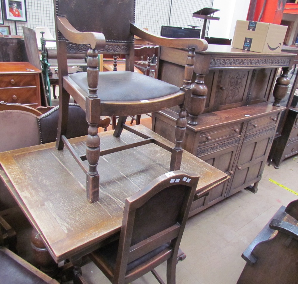 A 20th century oak drawleaf dining table together with a set of five oak chairs and a court