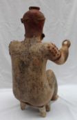 A pre-Columbian type Jalisco style bichrome pottery figure,