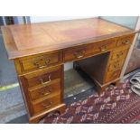 A Victorian pedestal desk with a leather inset top above a central drawer and two pedestals of