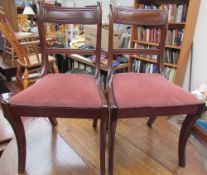 A set of six late Regency style mahogany dining chairs,