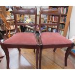 A set of six late Regency style mahogany dining chairs,