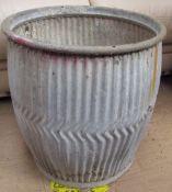 A tin wash barrel,