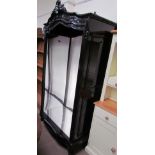 A shop display cabinet ion the form of a French armoire,